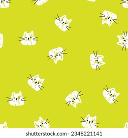 Simple cute cat pattern. Seamless vector pattern with white cat heads on green background 
