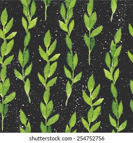 Simple and cute floral seamless pattern. Spring branches and leaves isolated on black background with splatters. Vectorized watercolor drawing.