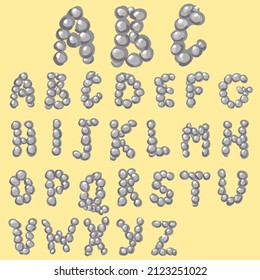 simple, cute font made of stylized round stones. the letters are lined with gray pebbles. decorative english alphabet. capital letters for games and children's books. font for primitive inscriptions