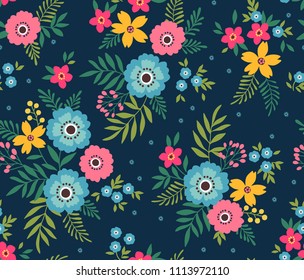 Simple cute pattern in small pink and blue flowers on dark blue background. Liberty style. Ditsy print. Floral seamless background. The elegant the template for fashion prints.