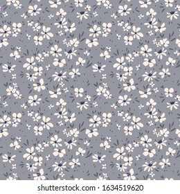 Simple cute pattern in small white  flowers on gray background. Liberty style. Ditsy print. Floral seamless background. The elegant the template for fashion prints.