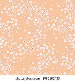 Simple cute pattern in small white flowers on coral background. Liberty style. Ditsies print. Floral seamless background. The elegant the template for fashion prints.