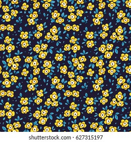 Simple cute pattern in small yellow and blue flowers on dark blue background. Liberty style. Ditsy print. Floral seamless background. The elegant the template for fashion prints.