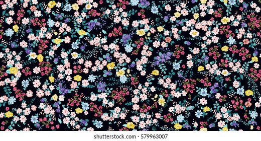 Simple cute pattern in small-scale flowers. Millefleurs. Liberty style. Floral seamless meadow background for textile or book covers, manufacturing, wallpapers, print, gift wrap and scrapbooking.