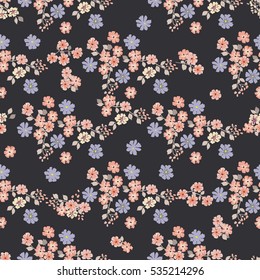 Simple cute pattern in small-scale pink and blue flowers. Millefleurs. Liberty style. Floral seamless background for textile, book covers, manufacturing, wallpapers, print, gift wrap and scrapbooking.