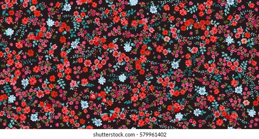 Simple cute pattern in small-scale red flowers. Millefleurs. Liberty style. Floral seamless background for textile or book covers, manufacturing, wallpapers, print, gift wrap and scrapbooking.