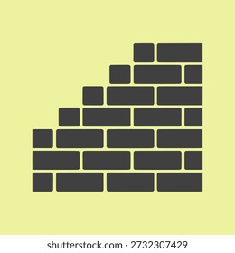 Um gráfico de parede de tijolo cinza escuro simples em um plano de fundo amarelo pálido, simbolizando a construção ou blocos de construção.