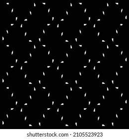 Simple decoration with zigzags and parallelogram shapes, made of small angular white fragments arranged on a black surface. Textile pattern.