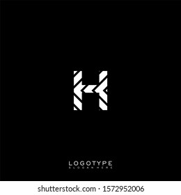 simple decorative white striped H logotype isolated on black background.
