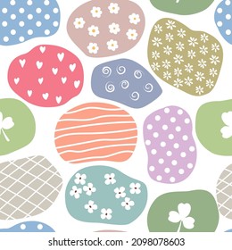 Simple doodle seamless pattern Hand drawn pastel scraps of fabric with different baby elements on a white background.