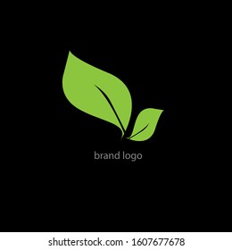 the simple elegant logo of two green leaf with black background