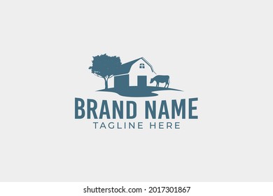 a simple farming logo with barn and cow images in a wide field