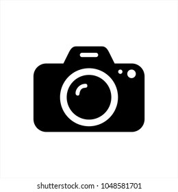 Simple, flat, black and white camera icon (silhouette). Isolated on white
