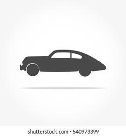 Simple Floating Classic Car Icon Viewed From The Side Colored In Dark Grey With Drop Shadow