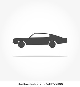 simple floating classic muscle car icon viewed from the side colored in dark grey with drop shadow