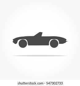 simple floating convertible car icon viewed from the side colored in dark grey with drop shadow