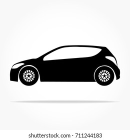 simple floating hatchback car icon viewed from the side colored in flat black with detailed rims and drop shadow