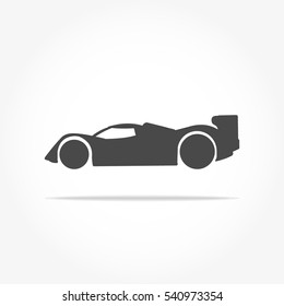 simple floating racing car icon viewed from the side colored in dark grey with drop shadow
