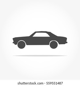 simple floating sedan car icon viewed from the side colored in flat dark grey with drop shadow