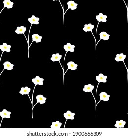 Simple floral rural seamless pattern. Small white flowers against a black background. For prints of fabric, textile products, clothing, packaging.