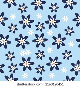 Simple floral seamless pattern. Dark blue and small white flowers on pastel blue background. Textile, paper wrapping and graphic design.