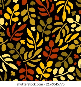 Simple floral vector seamless pattern. Dry golden brown, red leaves, branches on a black background. For fabric prints, textiles. Autumn-summer collection. Seasonal leaf fall.