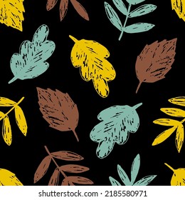 Simple floral vector seamless pattern. Dry golden brown leaves on a black background. For printing on fabric, textiles, stationery. Autumn-summer collection. Seasonal leaf fall.