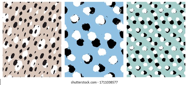 Simple Freehand Spots Seamless Vector Patterns. White and Black Hand Drawn Brush Dots Isolated on a  Light Blue, Gray and Mint Green Background. Rough Irregular Geometric Print for Fabric, Textile. 