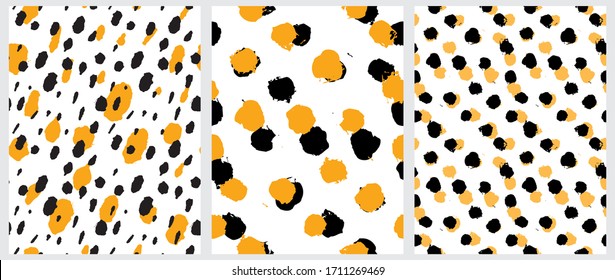 Simple Freehand Spots Seamless Vector Patterns. Warm Yellow and Black Hand Drawn Brush Dots Isolated on a  White Background. Rough Irregular Geometric Print for Fabric, Textile. 
