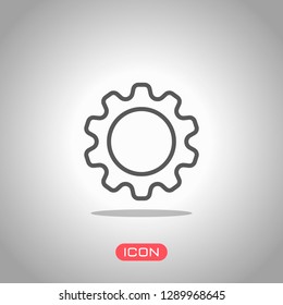 Simple gear symbol, Linear icon with thin outline. Icon under spotlight. Gray background