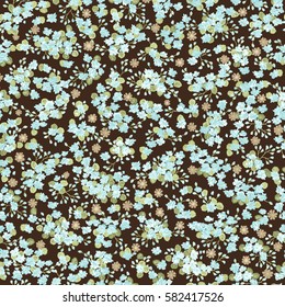 Simple gentle pattern in small-scale blue flower. Millefleurs. Liberty style. Floral seamless background for textile or book covers, manufacturing, wallpapers, print, gift wrap and scrapbooking.