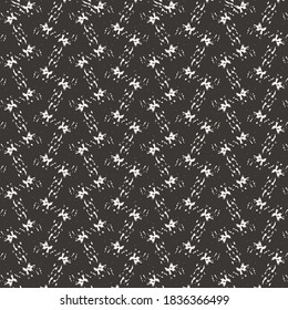 Simple geometric pattern, in dark blue and white, composed of small streaks and splashes. Textile design.
