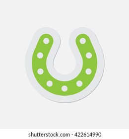 simple green icon with contour and shadow - horseshoe with holes on a white background