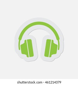 simple green icon with contour and shadow - headphones on a white background