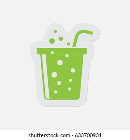 simple green icon with light gray contour and shadow - glass with carbonated drink and straw on a white background