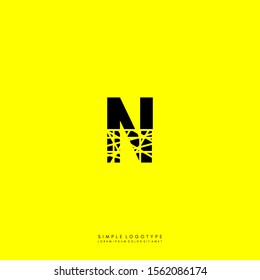 simple half cracked monogram N logo letter isolated on yellow background design concept