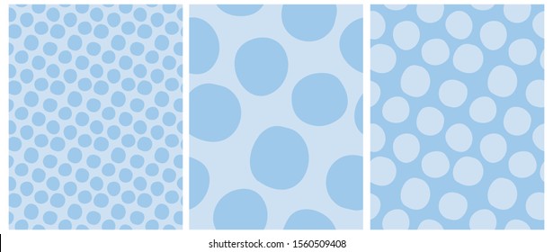 Simple Hand Drawn Irregular Dots Vector Patterns. Big Light Blue Polka Dots on a Pastel Blue Background. Tiny Dots on a Bright Background. Infantile Style Abstract Dotted Print for Fabric, Decoration.