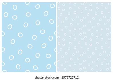 Simple Hand Drawn Irregular Dots Seamless Vector Pattern. White Empty Circles Isolated on a Blue Background. Infantile Style Abstract Dotted Vector Print Ideal for Fabric, Textile, Wrapping Paper.