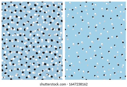 Simple Hand Drawn Irregular Dots Vector Patterns. Black, Gray and White Dots on a Light Blue Background. Infantile Style Abstract Dotted Vector Print for Fabric, Textile and Wrapping Paper.