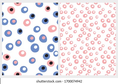 Simple Hand Drawn Irregular Dots Seamless Vector Patterns. White, Blue and Pink Various Size Dots Isolated on a White Background. Pink Circles on a White. Abstract Irregular Dotted Print.