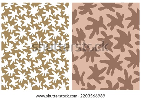 Simple Hand Drawn Irregular Spots Seamless Vector Patterns. White and Brown Irregular Shape Stains on a Terracotta and Gold Background. Infantile Style Abstract Spotted Vector Print.