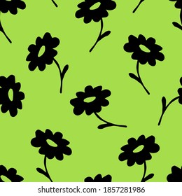 Simple hand-drawn floral vector seamless pattern. Black silhouette of chamomile on a bright green background. Wildflowers, nature, for prints of fabric, wrapping paper, textile products, clothing.