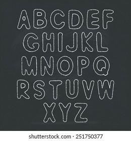 Simple handwritten alphabet on blackboard. Vector letters, EPS 8.