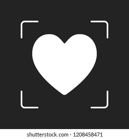 Simple heart icon. White object in camera autofocus on dark background