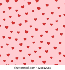 Simple hearts seamless vector pattern. Valentines day background. Flat design endless chaotic texture made of tiny heart silhouettes. Shades of red