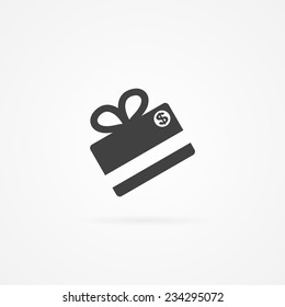 Simple icon of gift made with credit card. Shadow and white background.