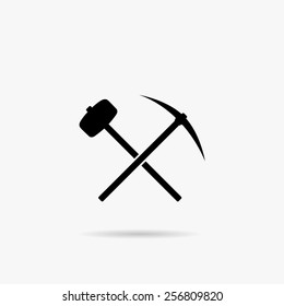 A simple icon with a pick-axe and hammer.