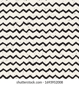 Simple ink zig zag lines geometric seamless pattern. Monochrome black and white strokes background. Hand drawn ink brushed texture for your design Simple ink zig zag lines geometric seamless pattern. Monochrome black and white strokes background. Hand drawn ink brushed texture for your design