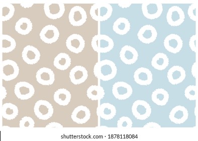 Simple Irregular Geometric Seamless Vector Patterns Set. White Freehand Cirlcles Isolalet on a Warm Gray and Pastel BlueBackground. Abstract Doodle Print ideal for Fabric, Textile.