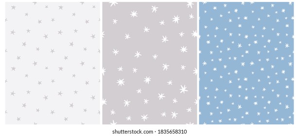 Simple Irregular Starry Seamless Vector Patterns. Simple Hand Drawn Stars Isolated on a Light Blue and Gray Background. Funny Infantile Style Repeatable Abstract Night Sky Print ideal for Fabric.